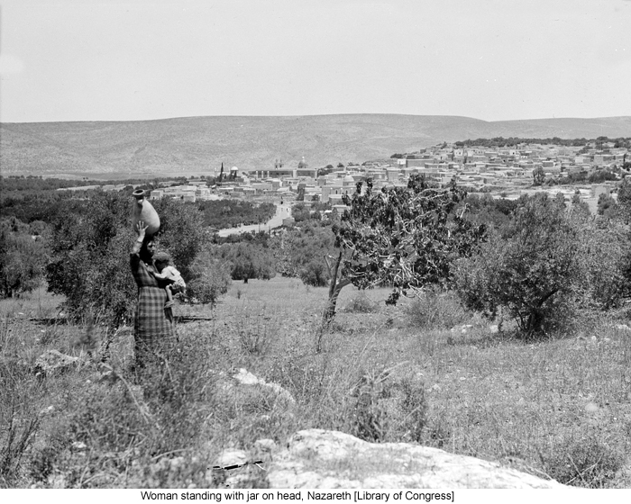 Woman standing with jar on head, Nazareth [Library of Congress]