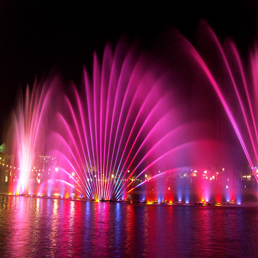 Colored pink fountain at night