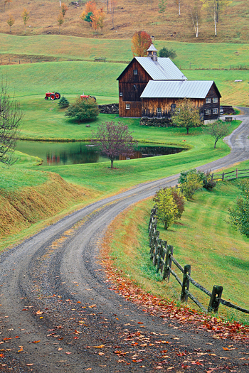 Winding dirt road leading to a farmhouse near Wodstock, Vermont