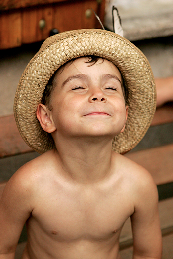 Happy little boy in sunhat