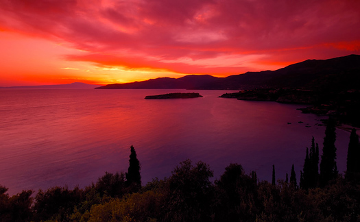 A spectacular red and pink sunset over the bay of Kardamili, southern Greece