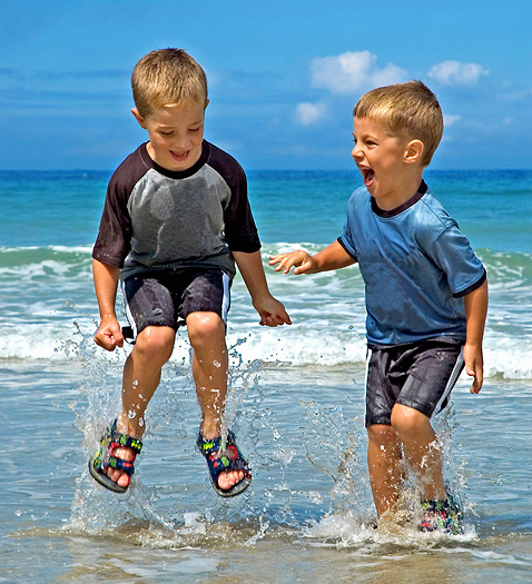 Two little boys playing in the sea