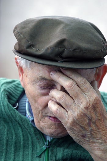 Elderly man deep in thought