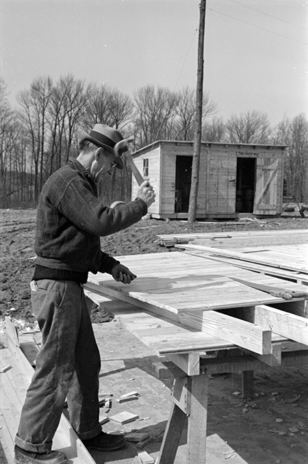 Carpenter at the Greenbelt Project, Berwyn, Maryland by Paul Carter [Library of Congress LC-DIG-fsa-8a20471]