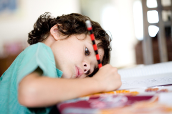 Young boy writing